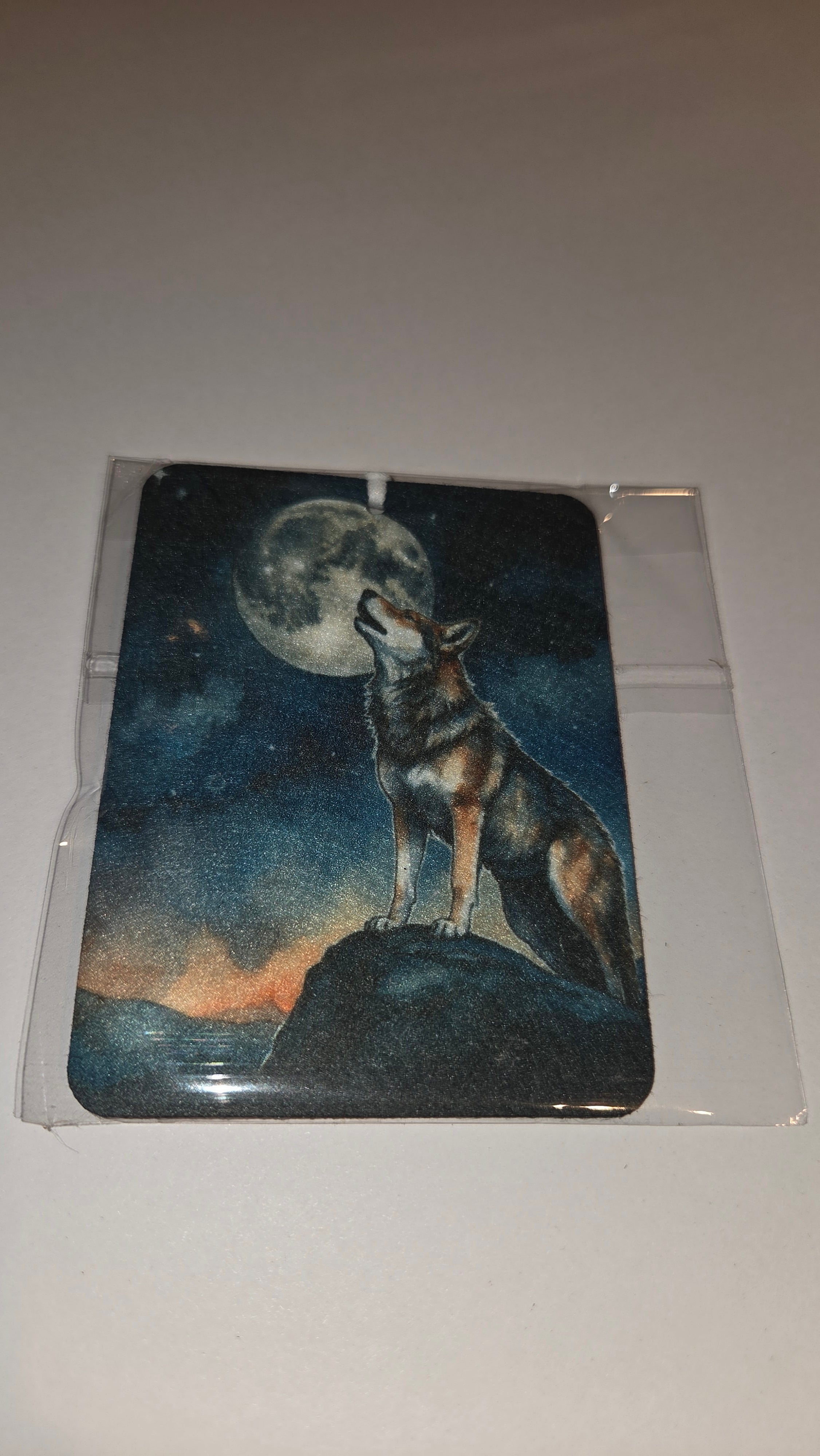 Wolf howling at the moon
