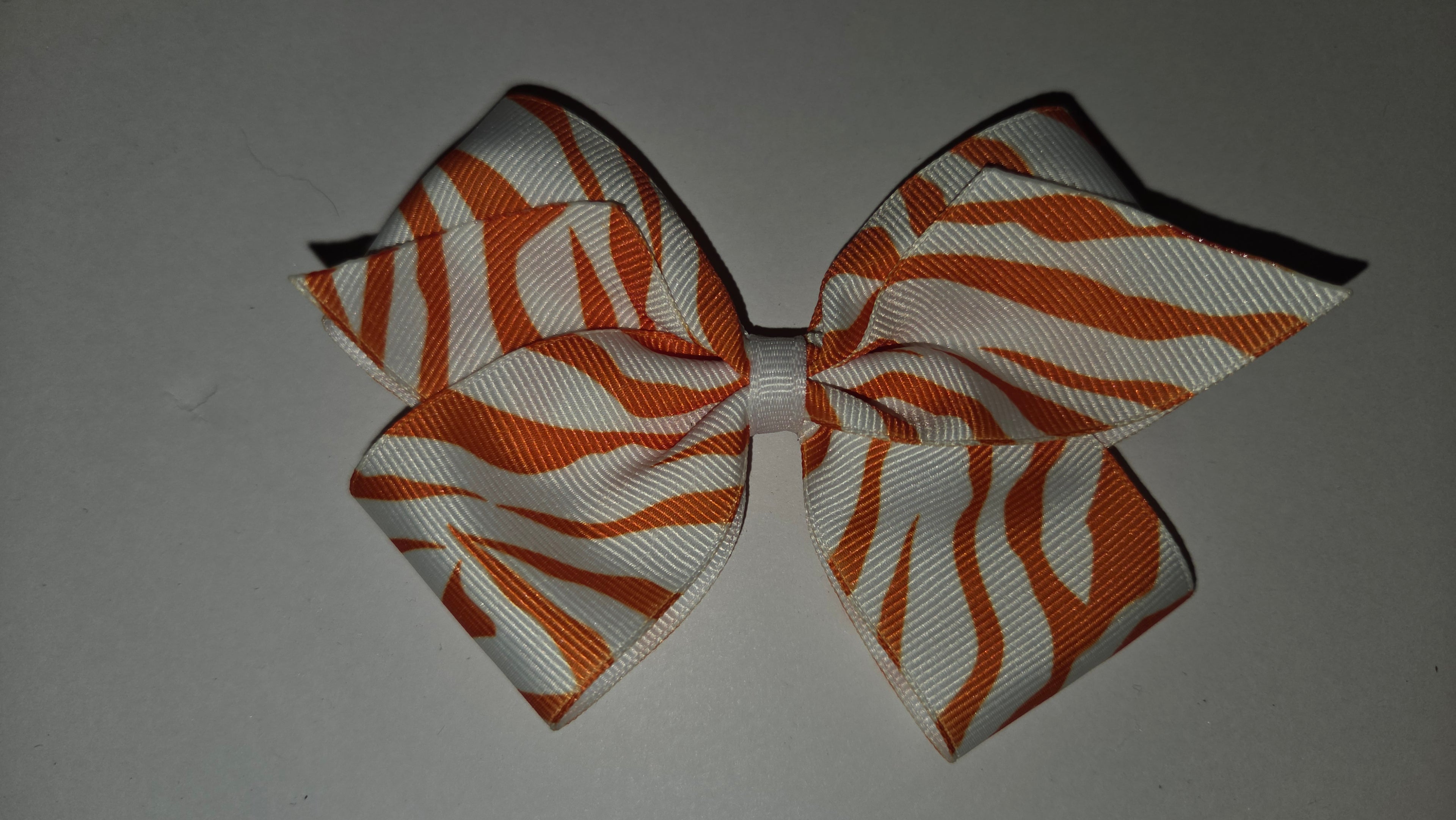 White w/ orange zebra print